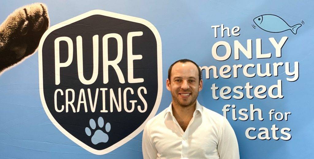 Sean Wittenberg in front of Pure Cravings sign cropped Science & Technology: The Dangers of Heavy Metals in Pet Food